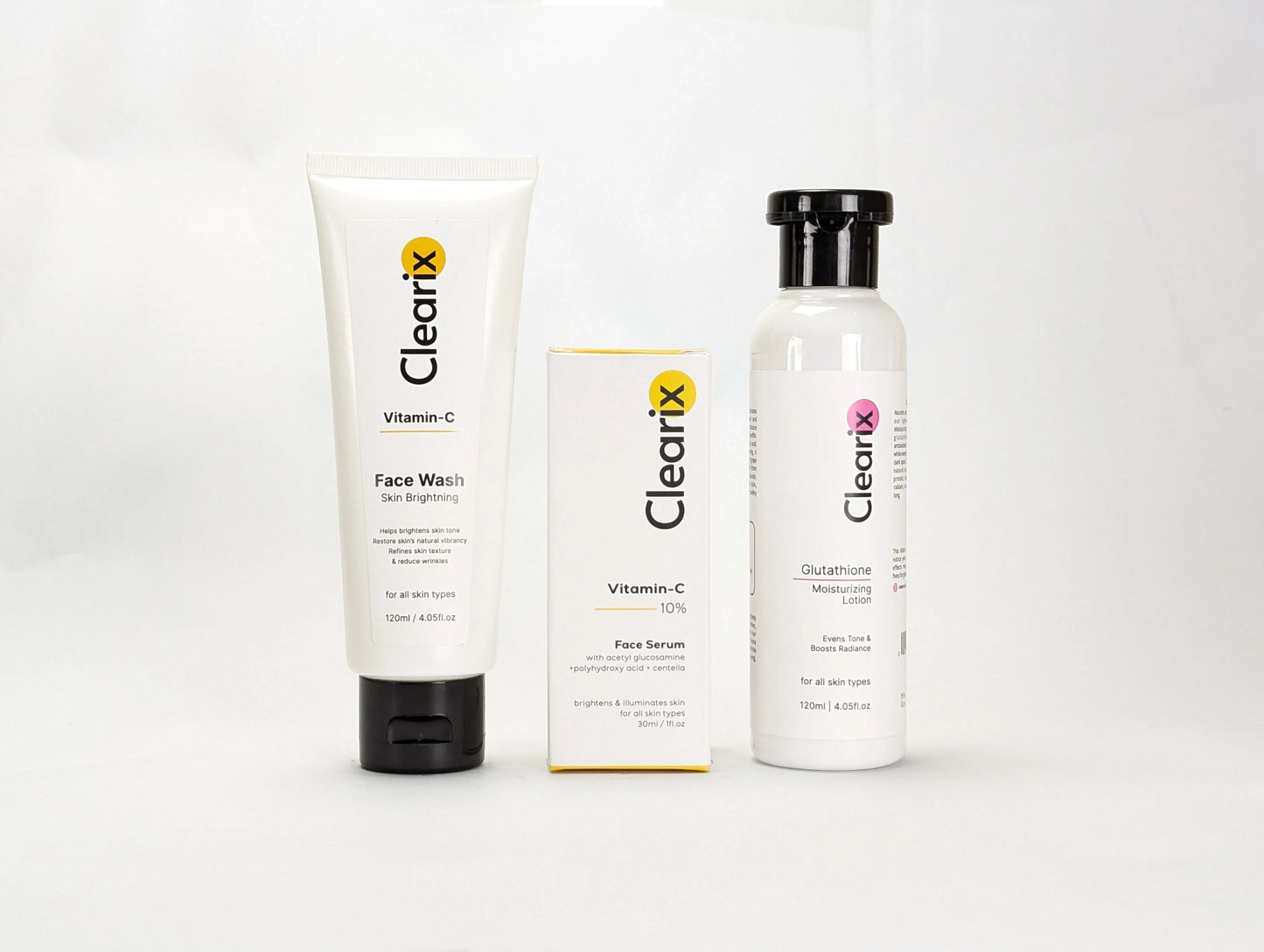 Clearix skincare products displayed against a white background. The image features three items: a Clearix Vitamin-C Face Wash in a white tube for skin brightening, a Clearix Vitamin-C 10% Face Serum in its original yellow and white packaging for enhanced radiance, and a Clearix Glutathione Moisturizing Lotion in a white bottle with a flip-top cap for hydration and even skin tone. Each product is designed to nourish, brighten, and improve overall skin health.