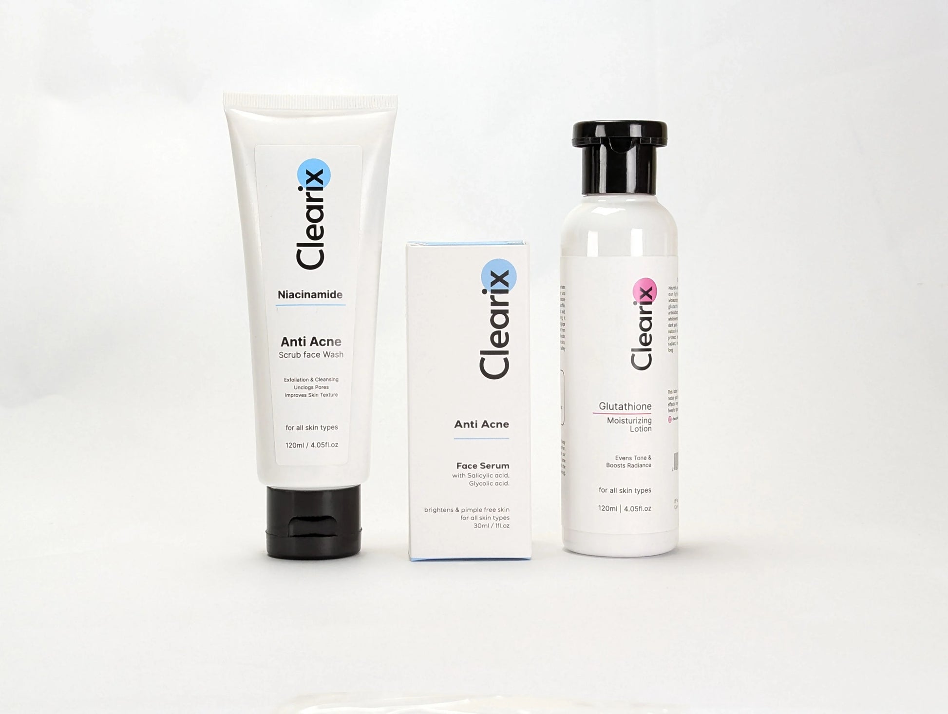 Clearix skincare products displayed on a white background. The lineup includes a Clearix Niacinamide Anti-Acne Scrub Face Wash in a white tube, a Clearix Anti-Acne Face Serum in its original white and blue packaging, and a Clearix Glutathione Moisturizing Lotion in a white bottle with a flip-top cap. These products are formulated to target acne, brighten skin, and provide hydration.