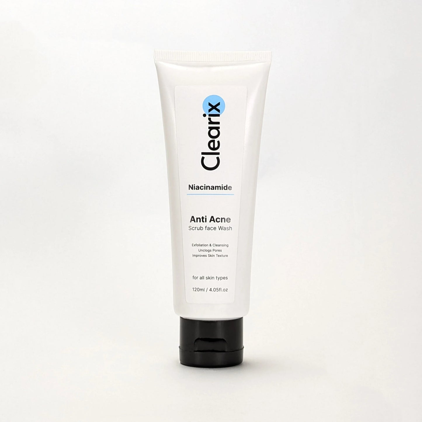 Clearix Anti Acne Scrub Face Wash displayed against a white background. The product is housed in a sleek white 120ml tube with a black flip-top cap. Infused with Niacinamide, this face wash exfoliates, cleanses, unclogs pores, and improves skin texture, making it suitable for all skin types.