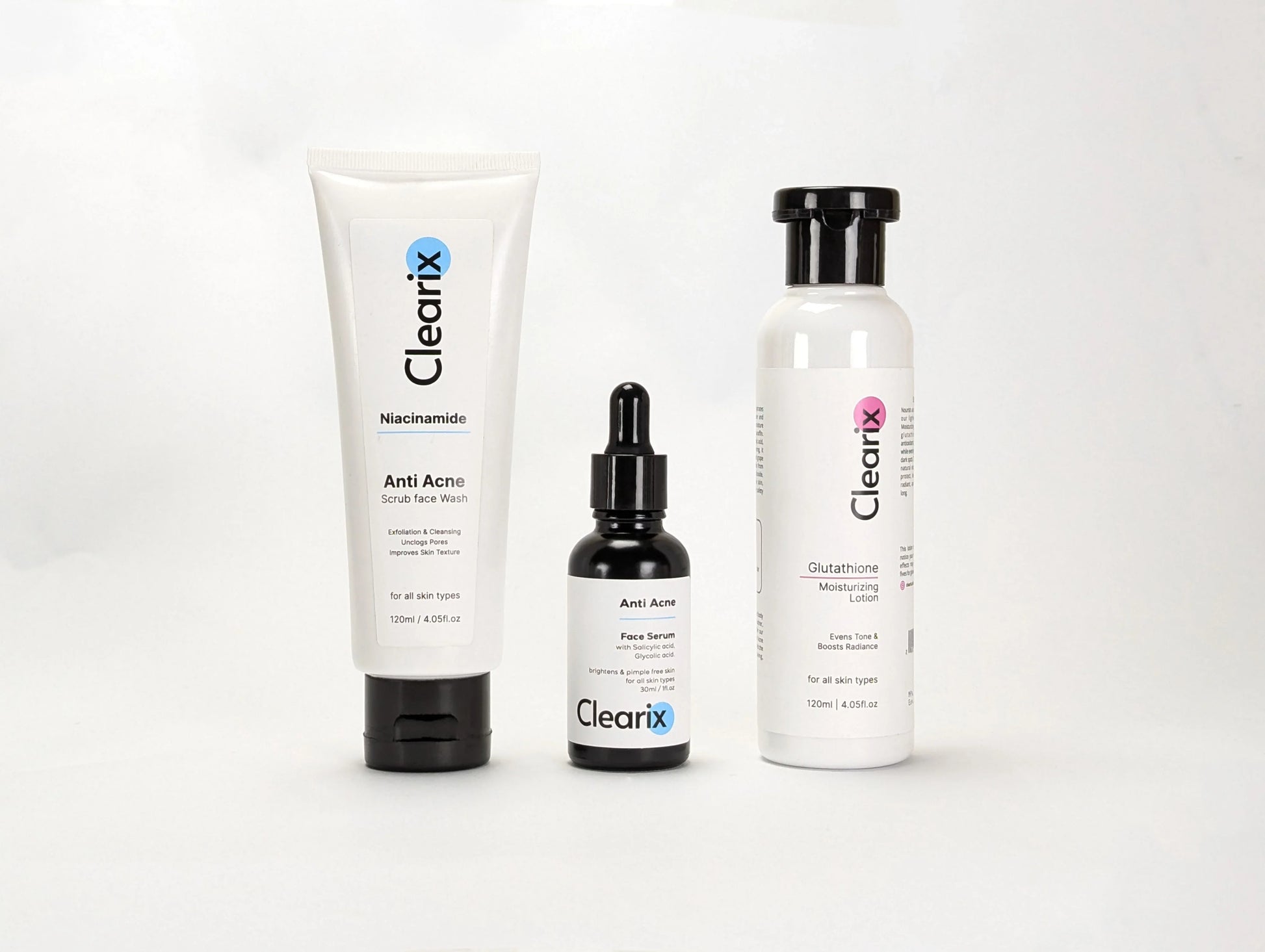 Clearix skincare products displayed against a white background. The image features three items: a Clearix Niacinamide Anti-Acne Scrub Face Wash in a white tube, a Clearix Anti-Acne Face Serum in a black dropper bottle, and a Clearix Glutathione Moisturizing Lotion in a white bottle with a flip-top cap. Each product is designed for skincare benefits like exfoliation, acne treatment, and hydration.