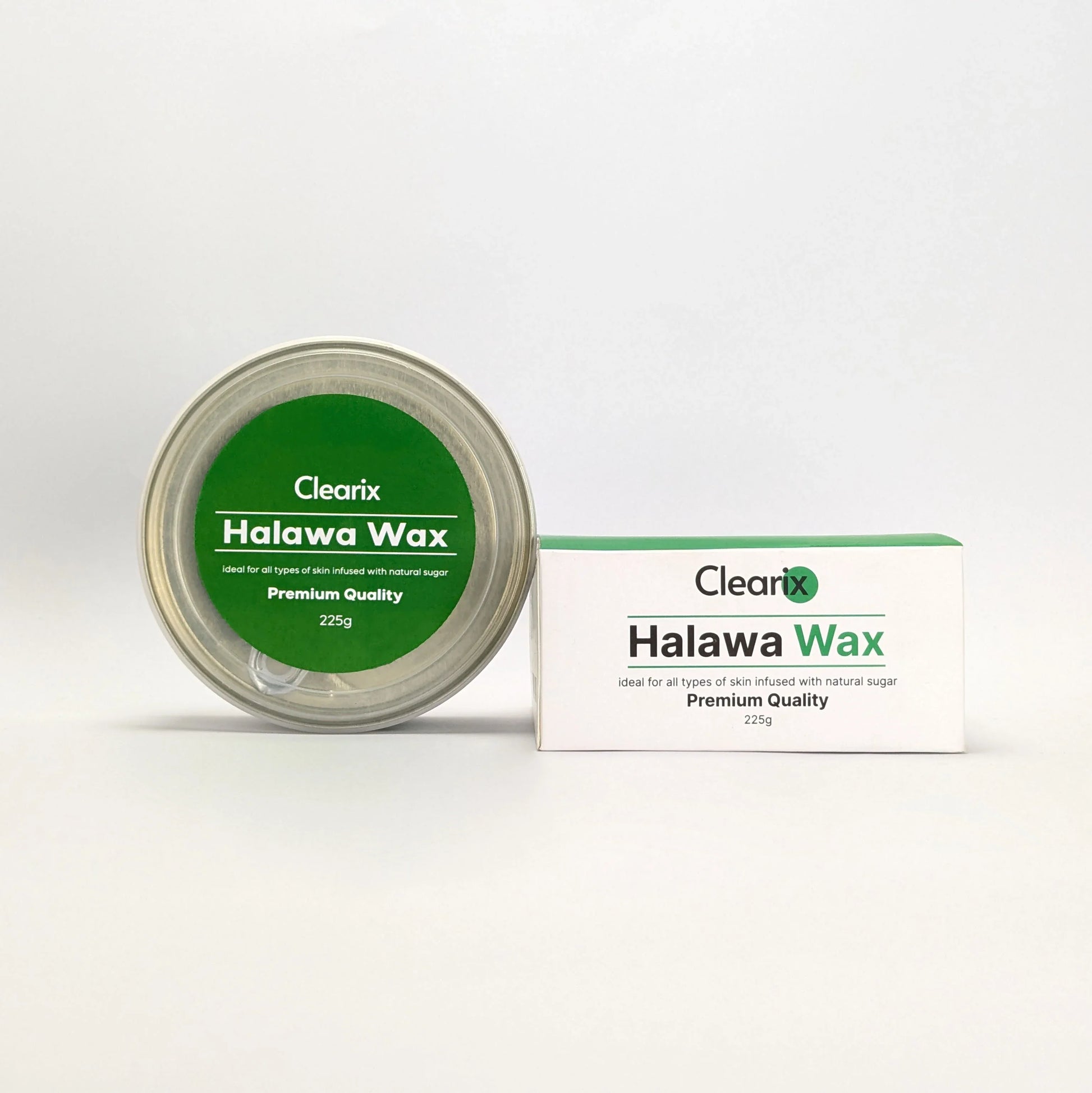 Clearix Halawa Wax hair removal product displayed against a white background. The image features a 225g tin with a green label and its matching packaging box. The product is infused with natural sugar and designed for all skin types, offering premium-quality hair removal.