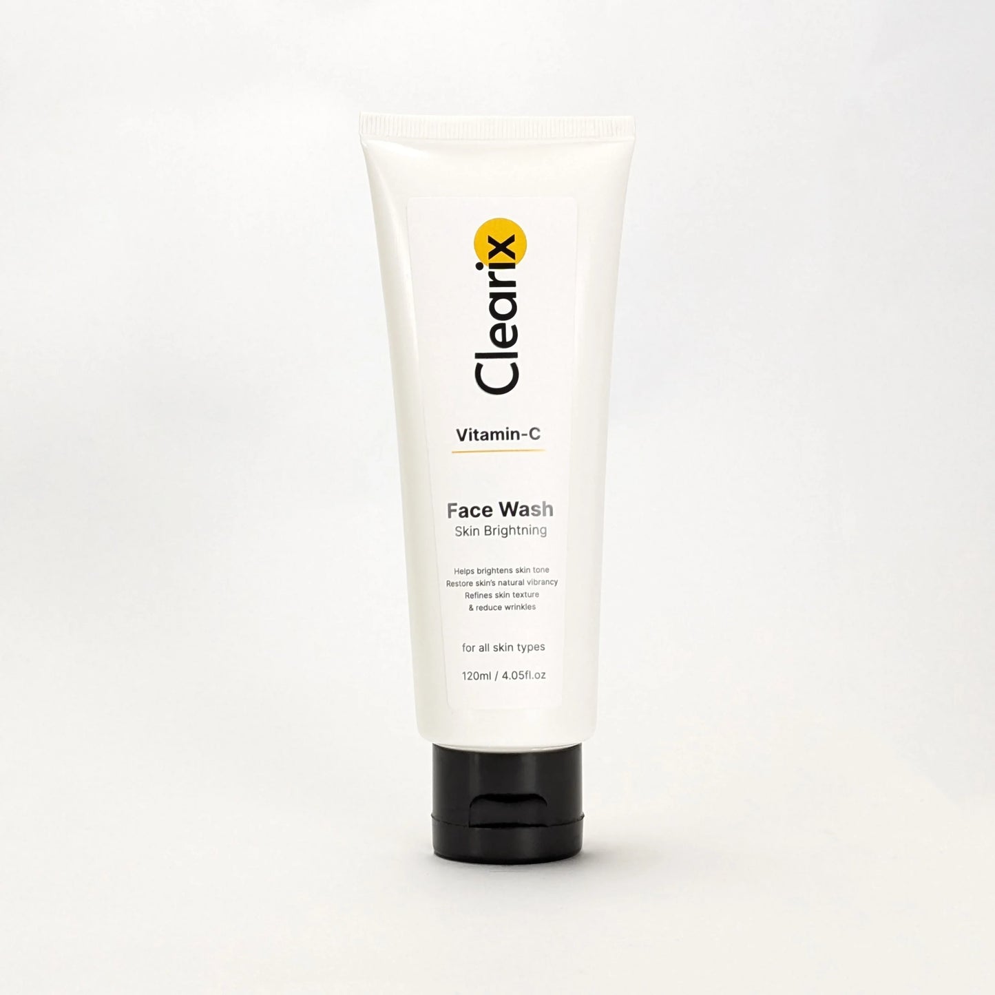 Clearix Vitamin-C Face Wash in a white tube with a black flip-top cap, displayed against a plain white background. The label emphasizes skin brightening, improving texture, reducing wrinkles, and restoring natural vibrancy. Suitable for all skin types.